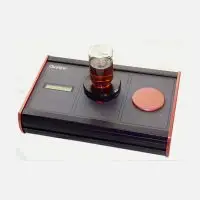 Black and red electronic device with digital display and glass container.