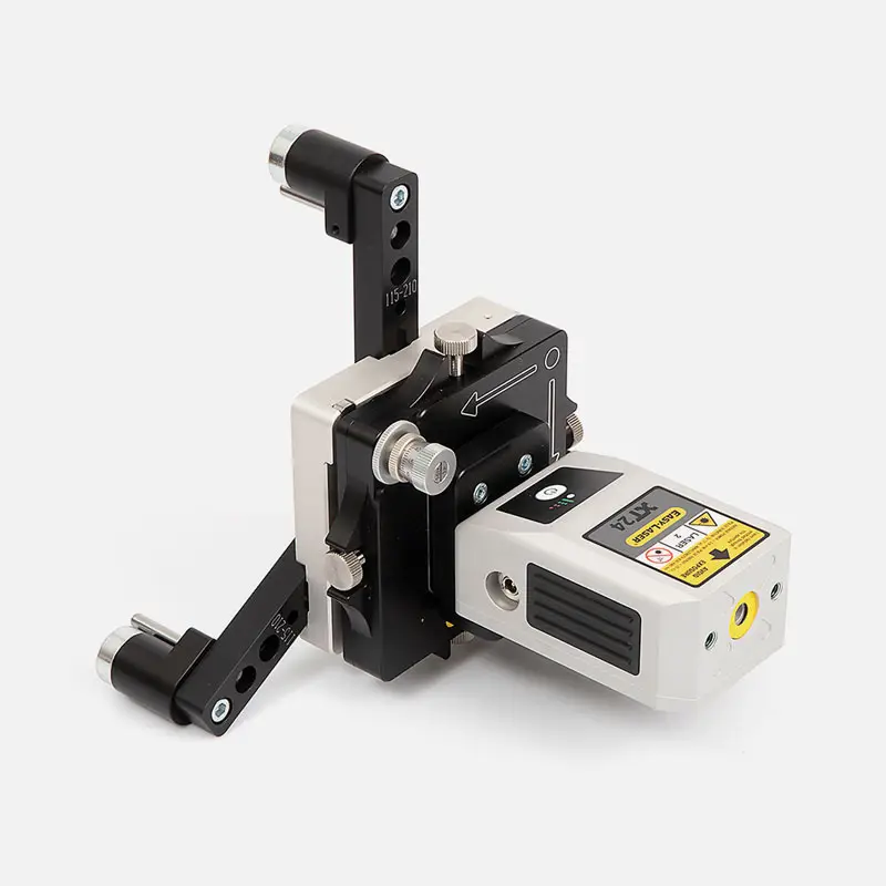 Close-up of Easy-Laser XT950 Bore Alignment machine with metal parts and warning labels.