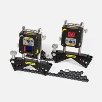 Two Easy-Laser XT660 alignment tools with digital displays on metal bases.