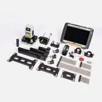 Industrial inspection tools on white surface, featuring Easy-Laser XT950 Bore Alignment system.