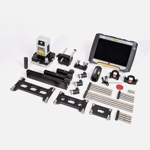 Industrial inspection tools on white surface, featuring Easy-Laser XT950 Bore Alignment system.