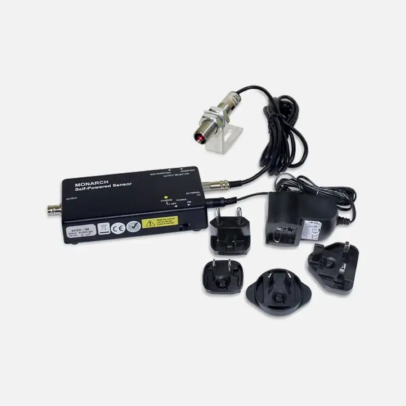 Black Monarch Safeguard sensor device with cables, probe, and five power plug adapters.