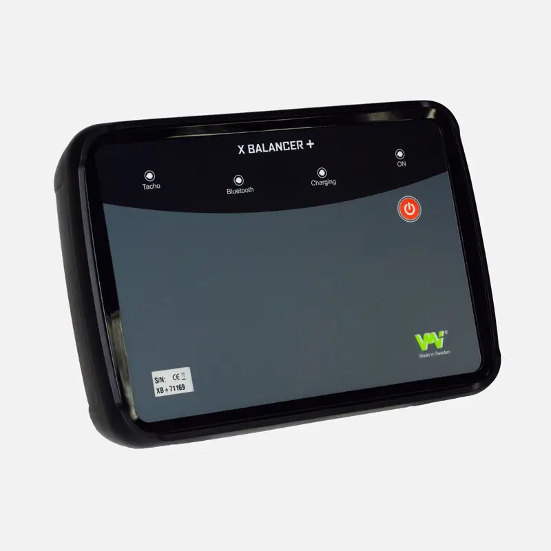 Black VMI XBalancer+ device with indicator lights and large power button.