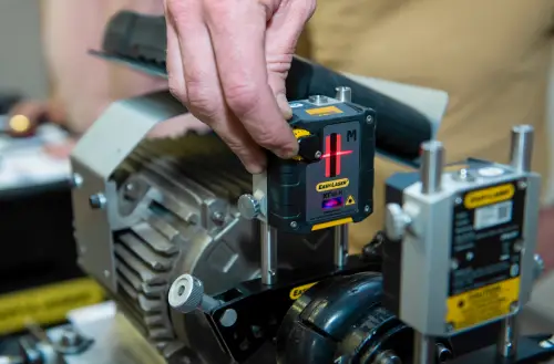 “Hand adjusting Easy-Laser sensor on motor shaft”
