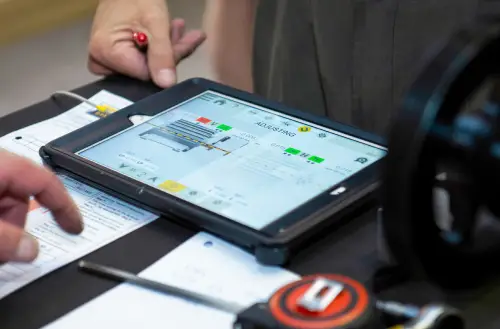 “Tablet displaying industrial schematic with coloured indicators”