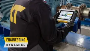 “Technician using XT tablet for machinery alignment in industrial setting”